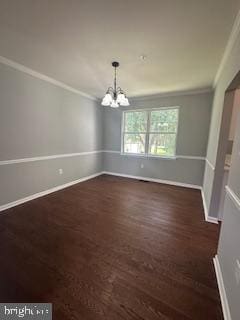 5920 Plata St, Clinton, MD 20735 - unfurnished dining area featuring ornamental molding, a chandelier, and wood finished floors