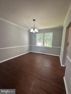 5920 Plata St, Clinton, MD 20735 - unfurnished dining area with crown molding, a chandelier, and wood finished floors