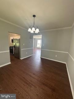 5920 Plata St, Clinton, MD 20735 - unfurnished dining area with a chandelier, dark wood finished floors, and crown molding