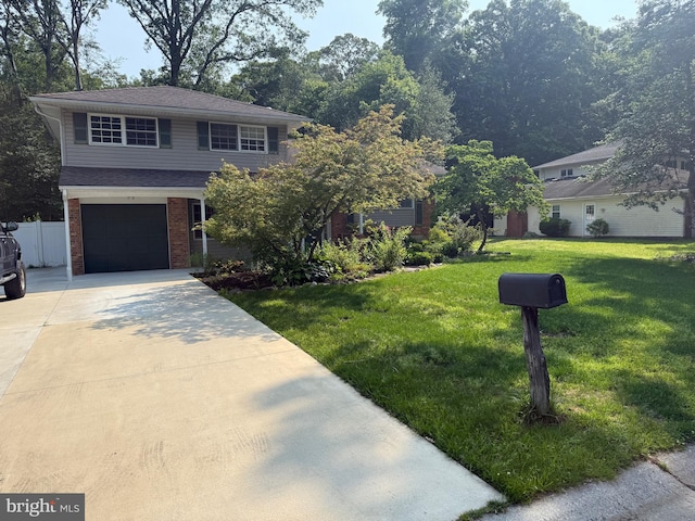 187 Merion Rd, Dover, DE 19904 - view of front of property with driveway, a garage, and brick siding