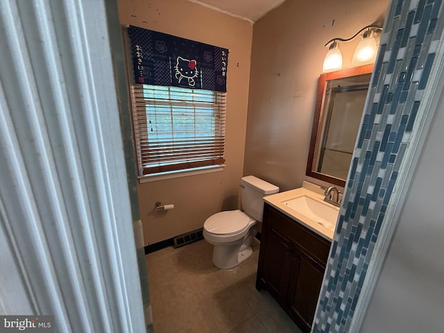 187 Merion Rd, Dover, DE 19904 - full bathroom with tile patterned flooring, toilet, vanity, and an enclosed shower