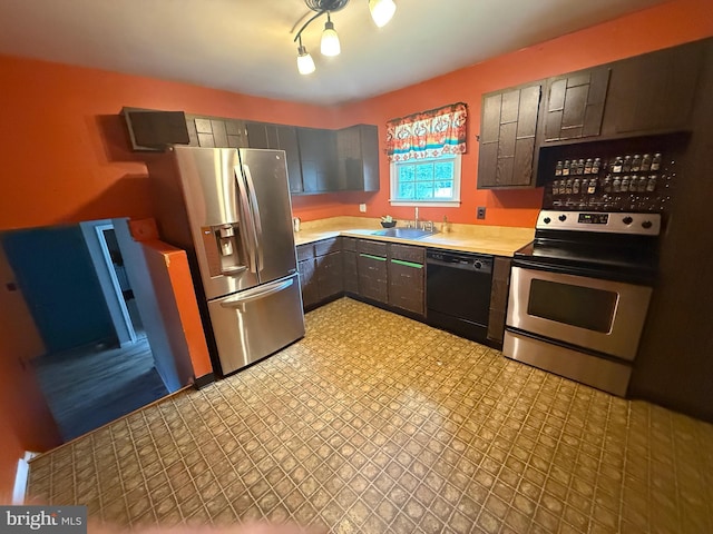 187 Merion Rd, Dover, DE 19904 - kitchen with stainless steel appliances, a sink, gray cabinetry, light floors, and light countertops