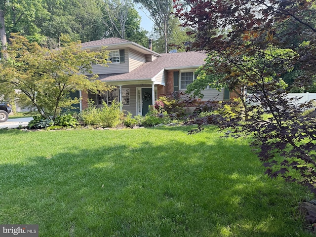 187 Merion Rd, Dover, DE 19904 - view of front facade featuring a front yard and roof with shingles