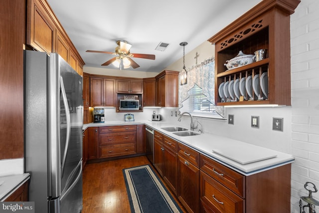 3685 1st Ave, Edgewater, MD 21037 - kitchen with stainless steel appliances, a ceiling fan, a sink, dark wood finished floors, and light countertops