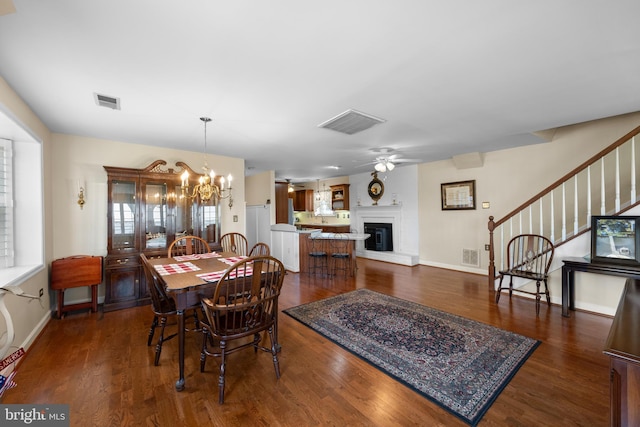 3685 1st Ave, Edgewater, MD 21037 - dining room featuring a chandelier, stairway, and dark wood finished floors