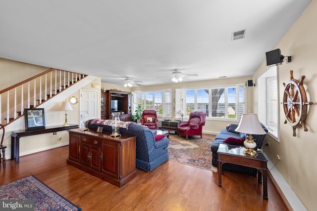 3685 1st Ave, Edgewater, MD 21037 - living area with stairs, wood finished floors, baseboards, and a ceiling fan