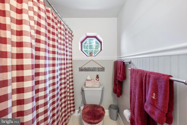 3685 1st Ave, Edgewater, MD 21037 - full bathroom with toilet, a wainscoted wall, and a shower with shower curtain