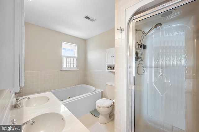 3685 1st Ave, Edgewater, MD 21037 - full bath featuring tile walls, a garden tub, toilet, a stall shower, and double vanity