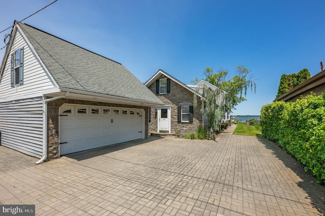 3685 1st Ave, Edgewater, MD 21037 - view of front facade featuring stone siding, decorative driveway, and a shingled roof