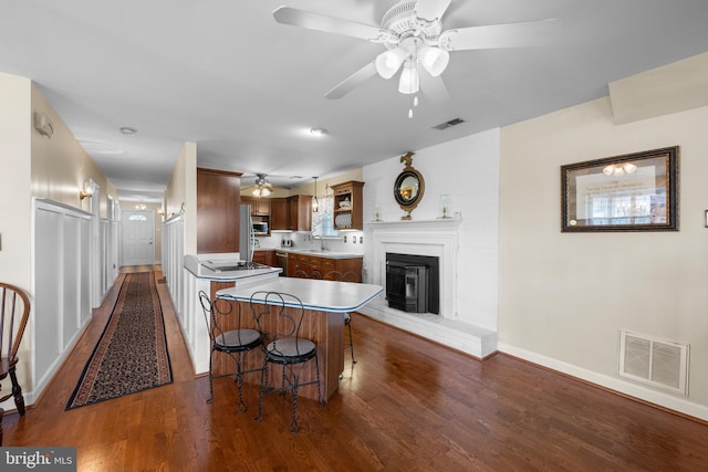 3685 1st Ave, Edgewater, MD 21037 - kitchen with a sink, a ceiling fan, dark wood finished floors, and baseboards