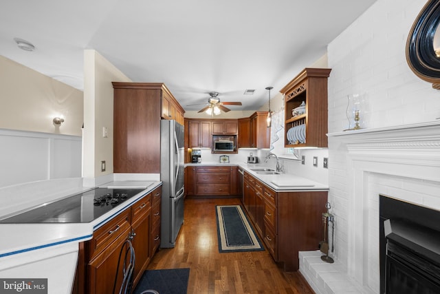 3685 1st Ave, Edgewater, MD 21037 - kitchen featuring appliances with stainless steel finishes, a sink, dark wood-style flooring, ceiling fan, and light countertops