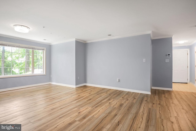 20406 Shore Harbour Dr Unit 4-A, Germantown, MD 20874 - spare room with crown molding, light wood-type flooring, and baseboards