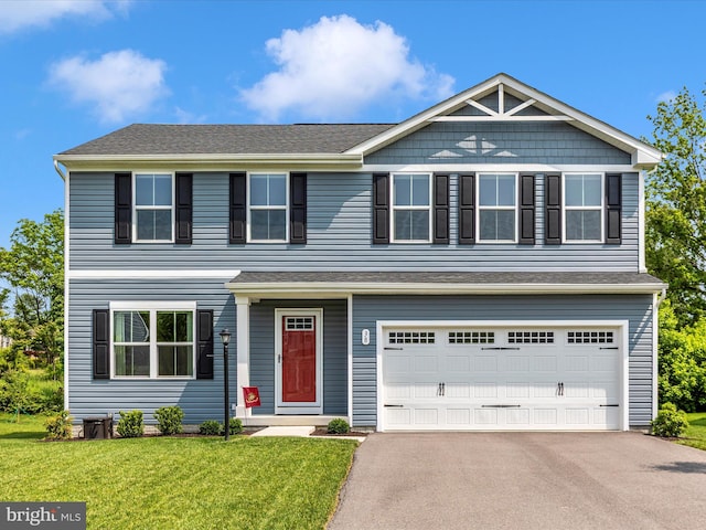38 Herman Gaver Pl, Hagerstown, MD 21740 - view of front of house featuring an attached garage, asphalt driveway, and a front yard