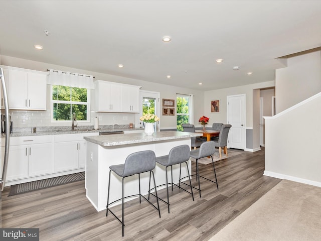 38 Herman Gaver Pl, Hagerstown, MD 21740 - kitchen with a kitchen island, white cabinets, healthy amount of natural light, and recessed lighting
