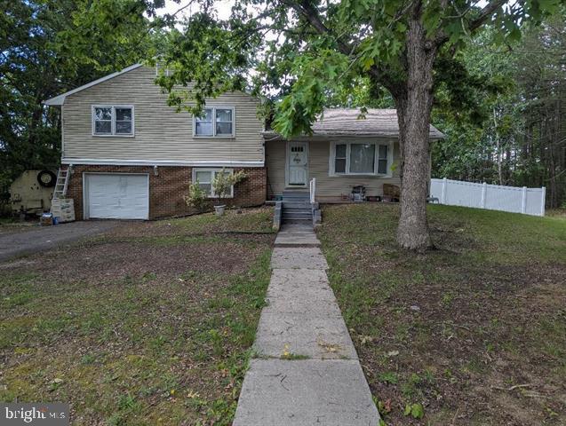 55 Atlas Lane Rd, Egg Harbor Township, NJ 08234 - tri-level home featuring an attached garage, driveway, and brick siding