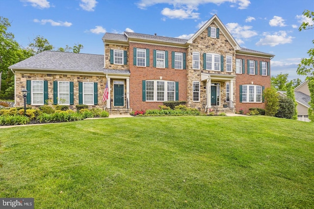 21550 Wild Timber Ct, Broadlands, VA 20148 - colonial house with a front yard, brick siding, and stone siding