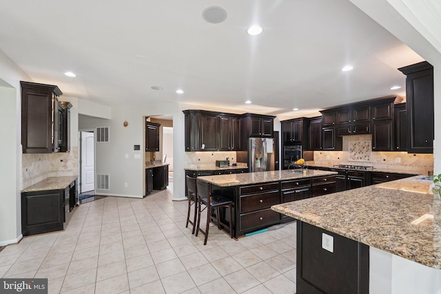 21550 Wild Timber Ct, Broadlands, VA 20148 - kitchen featuring stainless steel fridge with ice dispenser, decorative backsplash, a kitchen island, light tile patterned flooring, and light stone counters