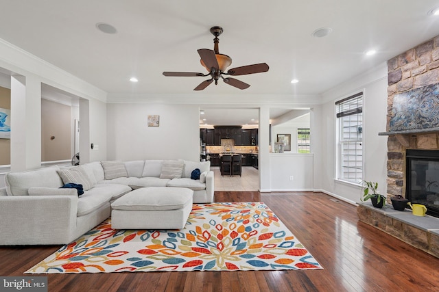 21550 Wild Timber Ct, Broadlands, VA 20148 - living room featuring ornamental molding, hardwood / wood-style floors, ceiling fan, and a fireplace