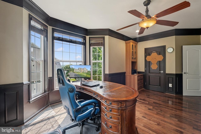21550 Wild Timber Ct, Broadlands, VA 20148 - home office featuring a wainscoted wall, crown molding, wood finished floors, a ceiling fan, and a decorative wall