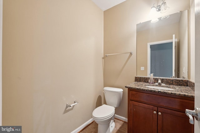 21550 Wild Timber Ct, Broadlands, VA 20148 - half bathroom with toilet, vanity, tile patterned flooring, and baseboards