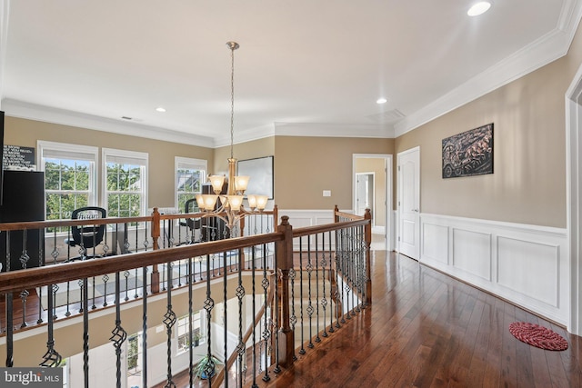 21550 Wild Timber Ct, Broadlands, VA 20148 - hall featuring a chandelier, wainscoting, hardwood / wood-style floors, crown molding, and an upstairs landing