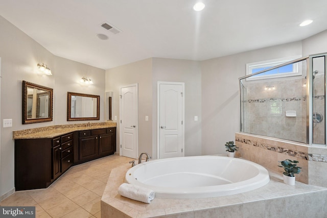 21550 Wild Timber Ct, Broadlands, VA 20148 - full bath featuring a garden tub, vanity, a shower stall, and tile patterned floors