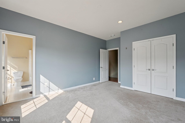 21550 Wild Timber Ct, Broadlands, VA 20148 - unfurnished bedroom featuring carpet flooring, a closet, baseboards, ensuite bath, and recessed lighting