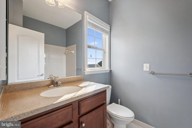 21550 Wild Timber Ct, Broadlands, VA 20148 - bathroom with toilet, vanity, and tiled shower