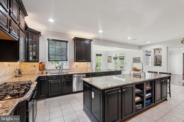 21550 Wild Timber Ct, Broadlands, VA 20148 - kitchen featuring stainless steel dishwasher, a sink, light tile patterned floors, a center island with sink, and recessed lighting