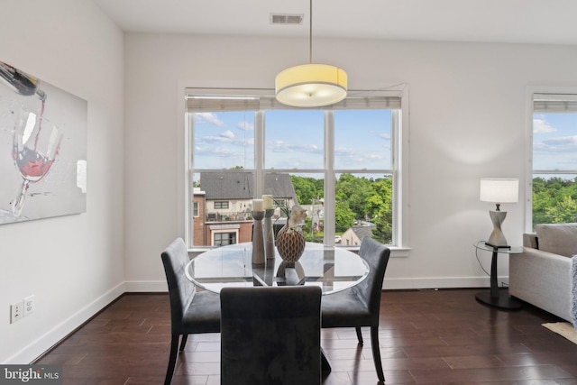 1107 S Walter Reed Dr S Unit 502, Arlington, VA 22204 - dining area featuring healthy amount of natural light, wood finished floors, and baseboards