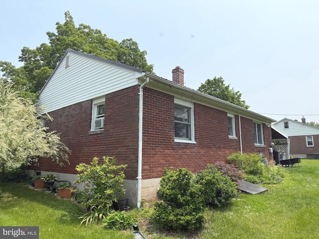 32 Meadow Ln, Gettysburg, PA 17325 - view of home's exterior with a lawn, a chimney, and brick siding