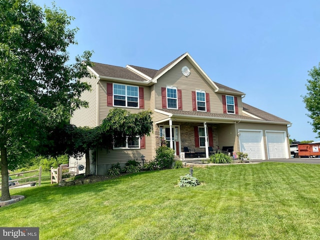 1915 Main St, Mohrsville, PA 19541 - view of front of house featuring covered porch, an attached garage, and asphalt driveway