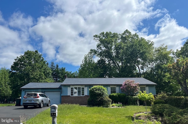 2545 Pioneer Rd, Hatboro, PA 19040 - ranch-style home with a garage, a front yard, driveway, and brick siding