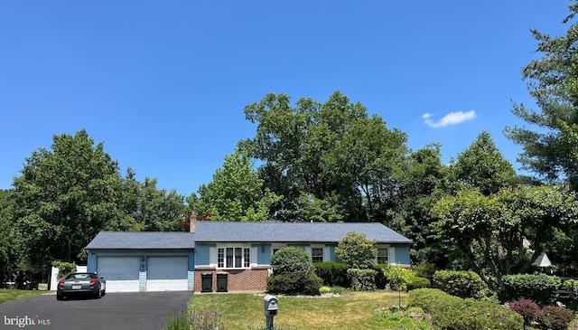 2545 Pioneer Rd, Hatboro, PA 19040 - ranch-style home featuring an attached garage, a front lawn, driveway, and a chimney
