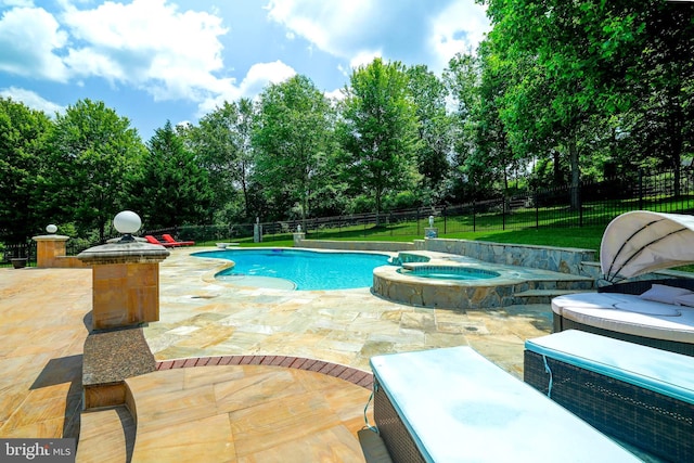 2506 Coulter Ln, Oakton, VA 22124 - view of swimming pool with a patio area, view of scattered trees, and a pool with connected hot tub