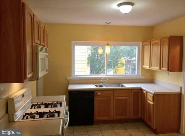 11 W Washington St, Paulsboro, NJ 08066 - kitchen featuring white appliances, a sink, light countertops, light tile patterned flooring, and pendant lighting