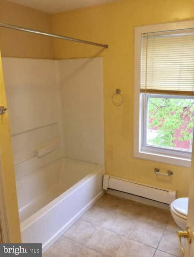 11 W Washington St, Paulsboro, NJ 08066 - full bath featuring a baseboard heating unit, toilet, tub / shower combination, and tile patterned flooring