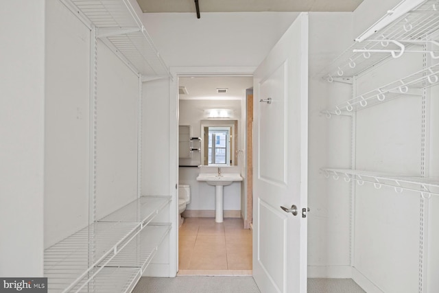 2125 14th St NW Unit 618, Washington, DC 20009 - walk in closet featuring tile patterned flooring