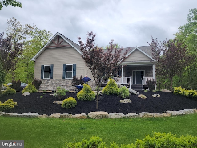 90 Corn Silk Ave, Hazleton, PA 18202 - view of front of house featuring stone siding, a porch, and a front lawn