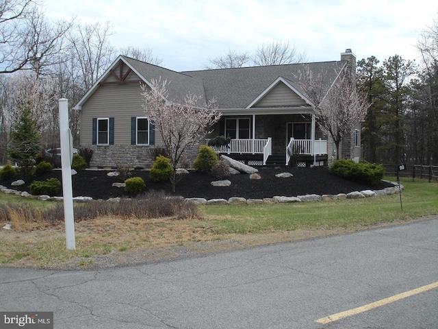90 Corn Silk Ave, Hazleton, PA 18202 - view of front facade with covered porch, a chimney, and stone siding