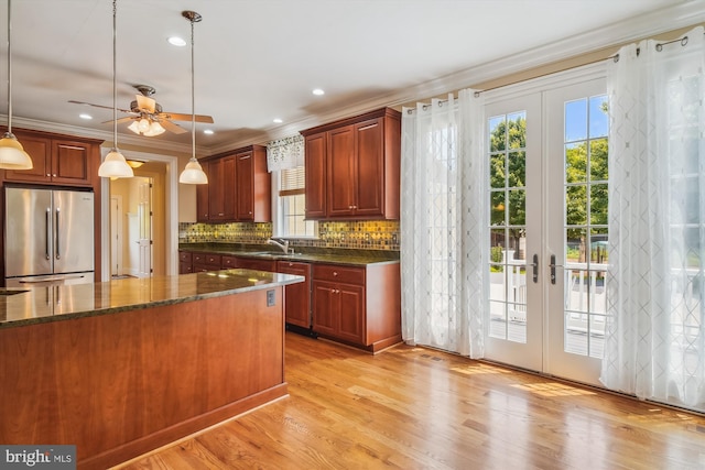 2375 Ballenger Creek Pike, Adamstown, MD 21710 - kitchen with high end fridge, healthy amount of natural light, french doors, crown molding, and decorative light fixtures