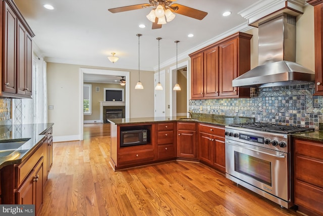 2375 Ballenger Creek Pike, Adamstown, MD 21710 - kitchen with stainless steel range, a ceiling fan, wall chimney range hood, black microwave, and a peninsula