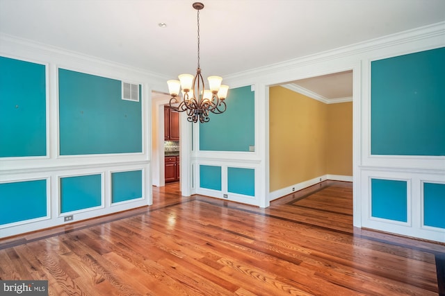 2375 Ballenger Creek Pike, Adamstown, MD 21710 - unfurnished room featuring a chandelier, ornamental molding, and wood finished floors
