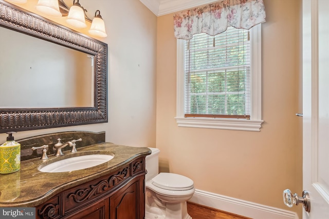 2375 Ballenger Creek Pike, Adamstown, MD 21710 - bathroom featuring toilet, vanity, wood finished floors, baseboards, and crown molding