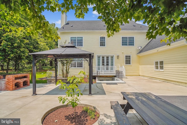 2375 Ballenger Creek Pike, Adamstown, MD 21710 - back of property featuring a gazebo, a patio area, a chimney, and a shingled roof