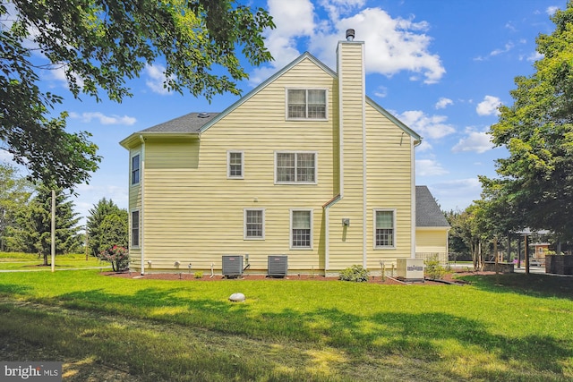 2375 Ballenger Creek Pike, Adamstown, MD 21710 - rear view of house with cooling unit, a chimney, and a yard