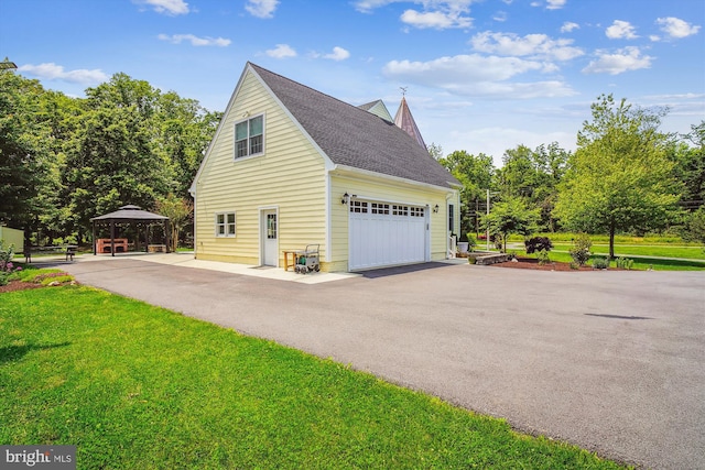 2375 Ballenger Creek Pike, Adamstown, MD 21710 - view of side of property featuring a gazebo, roof with shingles, and a yard