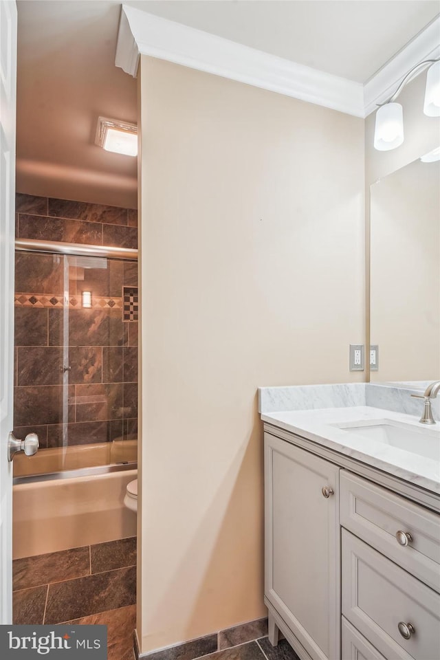 2375 Ballenger Creek Pike, Adamstown, MD 21710 - full bathroom with vanity, toilet, combined bath / shower with glass door, stone tile floors, and ornamental molding