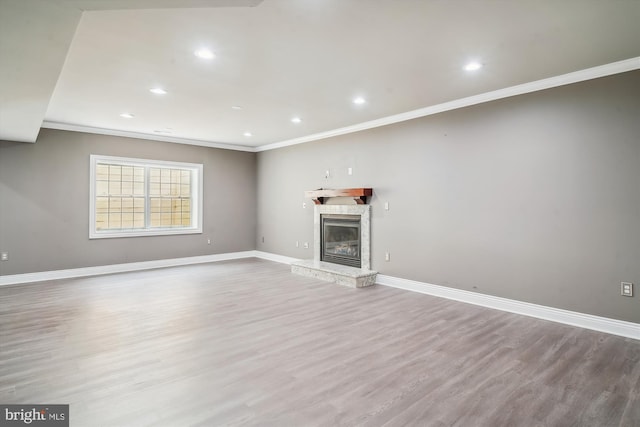 2375 Ballenger Creek Pike, Adamstown, MD 21710 - unfurnished living room featuring ornamental molding, wood finished floors, baseboards, recessed lighting, and a stone fireplace