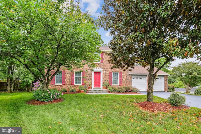 14616 Orangewood St, Silver Spring, MD 20905 - colonial home featuring brick siding, asphalt driveway, and a front yard